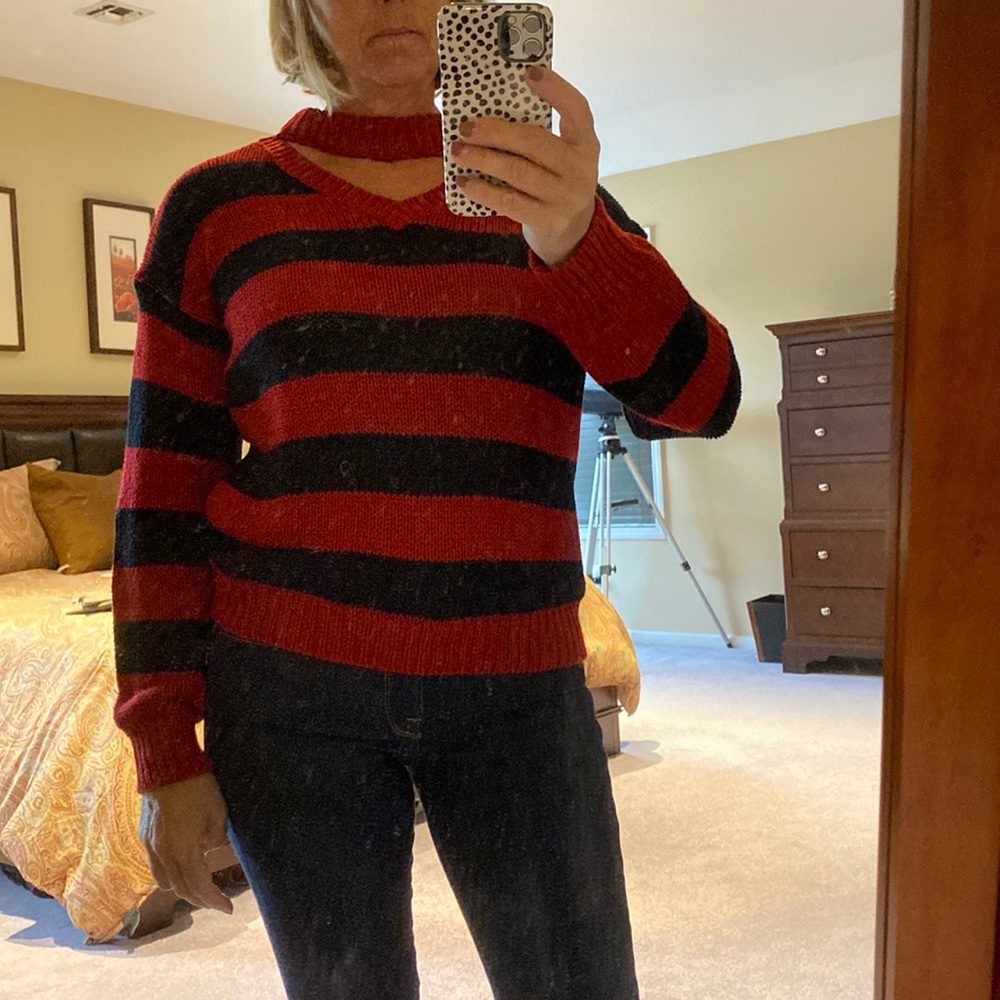 Red and black sweater with cut out neck